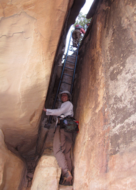 Patrice Rhoades-Baum explores vertical slot canyon, photo by Mike Baum